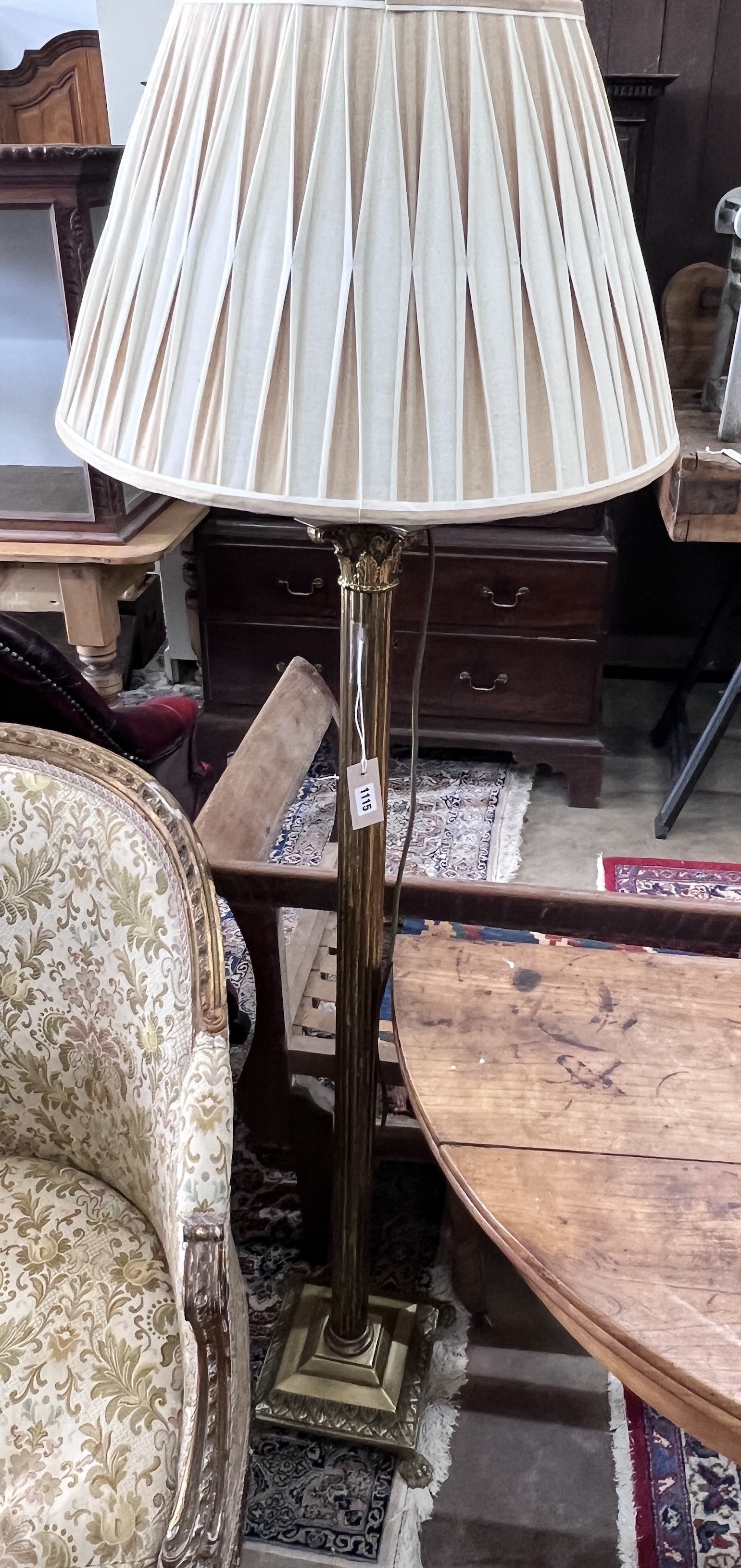 A brass Corinthian column standard lamp, height excluding shade 126cm